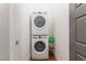 Efficient laundry area featuring stacked washer and dryer in a small space at 46 Bonterra Way, Chapel Hill, NC 27516