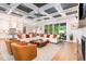 Open-concept living area with designer decor, modern ceiling, fireplace, and connected kitchen at 46 Bonterra Way, Chapel Hill, NC 27516