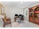 Bright office with a built-in bookcase, a large desk and two side chairs at 46 Bonterra Way, Chapel Hill, NC 27516