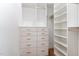 Spacious walk-in closet features custom storage solutions, including drawers, shelves and hanging rods at 46 Bonterra Way, Chapel Hill, NC 27516