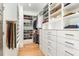 Organized walk-in closet featuring custom shelving and ample storage space for clothes and accessories at 46 Bonterra Way, Chapel Hill, NC 27516
