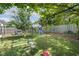 Spacious backyard featuring play equipment, a swing set, grassy lawn, and a wood fence at 5213 Holly Ridge Farm Rd, Raleigh, NC 27616