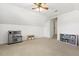 Expansive bonus room with neutral carpet, playroom area, and ample natural light at 5213 Holly Ridge Farm Rd, Raleigh, NC 27616