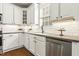 Bright kitchen featuring white cabinets, stainless steel appliances, subway tile backsplash, and stone countertops at 5213 Holly Ridge Farm Rd, Raleigh, NC 27616