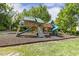Spacious community playground featuring slides, climbing structures, and padded ground cover for safety at 5213 Holly Ridge Farm Rd, Raleigh, NC 27616