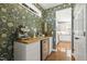 Wet bar with designer wall paper, built-in cabinets, wooden countertop, and beverage cooler at 5213 Holly Ridge Farm Rd, Raleigh, NC 27616