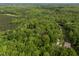 Beautiful aerial view of the lot nestled in a serene setting surrounded by lush trees, providing privacy at 5402 Shealtiel Way, Rougemont, NC 27572