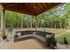 Inviting covered deck with comfortable seating and stylish decor, perfect for outdoor relaxation at 5402 Shealtiel Way, Rougemont, NC 27572