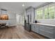 Bright, updated kitchen with stainless appliances, backyard access, and breakfast bar at 5402 Shealtiel Way, Rougemont, NC 27572