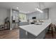 Well-equipped kitchen features stainless steel appliances, quartz counters, and ample storage at 5402 Shealtiel Way, Rougemont, NC 27572