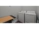 Laundry room featuring a side-by-side washer and dryer, along with a folding table for added convenience at 5402 Shealtiel Way, Rougemont, NC 27572