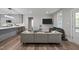 Inviting living room with modern furnishings, seamlessly connected to the kitchen area at 5402 Shealtiel Way, Rougemont, NC 27572
