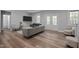 Bright living room showcases hardwood floors, neutral paint, and a cozy seating area at 5402 Shealtiel Way, Rougemont, NC 27572