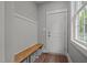 Mud room area includes bench, storage, and a window providing natural light at 5402 Shealtiel Way, Rougemont, NC 27572