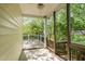Comfortable back porch surrounded by lush greenery at 5504 Creekdale Cir, Raleigh, NC 27612