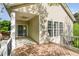 Relaxing back porch with wood floors and a ceiling fan for comfortable outdoor living at 5504 Creekdale Cir, Raleigh, NC 27612