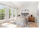 Sunlit bedroom with hardwood floors and bright natural light at 5504 Creekdale Cir, Raleigh, NC 27612