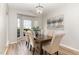 Elegant dining room with a chandelier and bright windows at 5504 Creekdale Cir, Raleigh, NC 27612