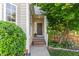 Welcoming front porch with brick steps, a charming door, and manicured landscaping at 5504 Creekdale Cir, Raleigh, NC 27612