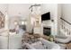 Spacious living room with fireplace, hardwood floors, and an open floor plan at 5504 Creekdale Cir, Raleigh, NC 27612