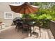 Spacious deck featuring an umbrella-covered table and grill, great for dining and barbecues outdoors at 5512 Bridgeman Ct, Durham, NC 27703
