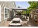 Spacious backyard featuring a deck area with comfortable seating, barbecue grill, and playhouse for outdoor enjoyment at 5512 Bridgeman Ct, Durham, NC 27703