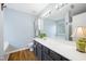 Bright bathroom with an expansive vanity, white countertop, and a decorative plant adding a touch of greenery at 5512 Bridgeman Ct, Durham, NC 27703