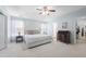 Spacious main bedroom with tray ceiling, ensuite bath access, and tasteful design at 5512 Bridgeman Ct, Durham, NC 27703