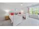 Cozy bedroom with two twin beds, carpet, and large window, filled with natural light at 5512 Bridgeman Ct, Durham, NC 27703