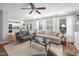 Inviting living room with hardwood floors, two couches and view to the kitchen at 5512 Bridgeman Ct, Durham, NC 27703