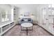 Stylish living room featuring built-in shelving and French doors at 5512 Bridgeman Ct, Durham, NC 27703