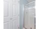 Clean bathroom featuring a shower with glass doors, complemented by a white door for a fresh look at 5512 Bridgeman Ct, Durham, NC 27703