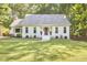 Charming single-story home with a well-manicured lawn and inviting front entrance at 5642 Falkirk Dr, Durham, NC 27712