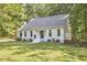 Charming home with green front lawn, large windows and a lovely front door at 5642 Falkirk Dr, Durham, NC 27712