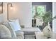 Stylish living room detail showcasing a comfortable sectional and an open view to the dining area at 5642 Falkirk Dr, Durham, NC 27712