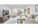 Bright living room with modern decor, stylish furniture, and large windows offering outdoor views at 5642 Falkirk Dr, Durham, NC 27712