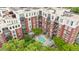 Aerial view of an apartment building featuring a shared pool and beautiful trees at 618 N Boylan Ave # 622, Raleigh, NC 27603