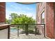 Balcony view of pool and lush greenery, offering a private outdoor retreat at 618 N Boylan Ave # 622, Raleigh, NC 27603