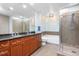 Modern bathroom with double vanity, large mirror, soaking tub, and glass enclosed shower at 618 N Boylan Ave # 622, Raleigh, NC 27603