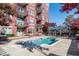 Beautiful building featuring a pristine community pool and lush landscaping on a sunny day at 618 N Boylan Ave # 622, Raleigh, NC 27603