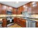 Modern kitchen with stainless steel appliances and beautiful backsplash at 618 N Boylan Ave # 622, Raleigh, NC 27603
