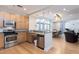 Kitchen features wooden cabinets, stainless steel appliances, and granite countertops at 618 N Boylan Ave # 622, Raleigh, NC 27603