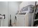 The laundry room has a side-by-side washer and dryer, along with cabinetry at 618 N Boylan Ave # 622, Raleigh, NC 27603