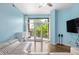 Inviting living room with light blue walls and sliding doors to a balcony at 618 N Boylan Ave # 622, Raleigh, NC 27603