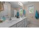 Bright bathroom features a double sink vanity with generous counter space and natural light at 624 Moultonboro Ave, Wake Forest, NC 27587