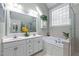 Bright bathroom with double vanity, a soaking tub, and separate shower at 624 Moultonboro Ave, Wake Forest, NC 27587