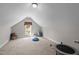 Bright bonus room with a vaulted ceiling perfect for use as a home gym or recreational space at 624 Moultonboro Ave, Wake Forest, NC 27587