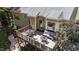 Aerial view of the wooden deck with comfortable wicker furniture and an outdoor dining space at 624 Moultonboro Ave, Wake Forest, NC 27587