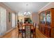Formal dining room with hardwood floors and elegant chandelier at 624 Moultonboro Ave, Wake Forest, NC 27587