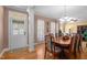 Formal dining room featuring hardwood floors and adjacent doorway at 624 Moultonboro Ave, Wake Forest, NC 27587